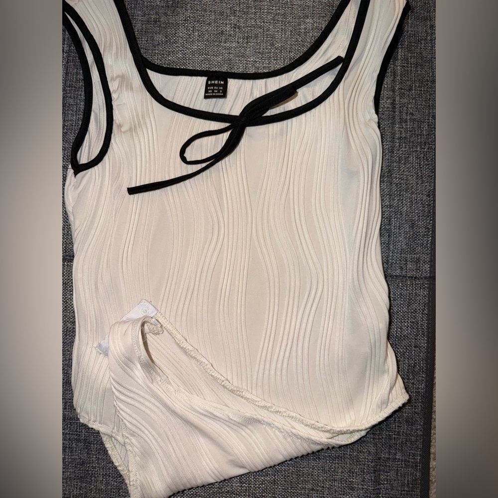 White Sleeveless Top with Black Trim
